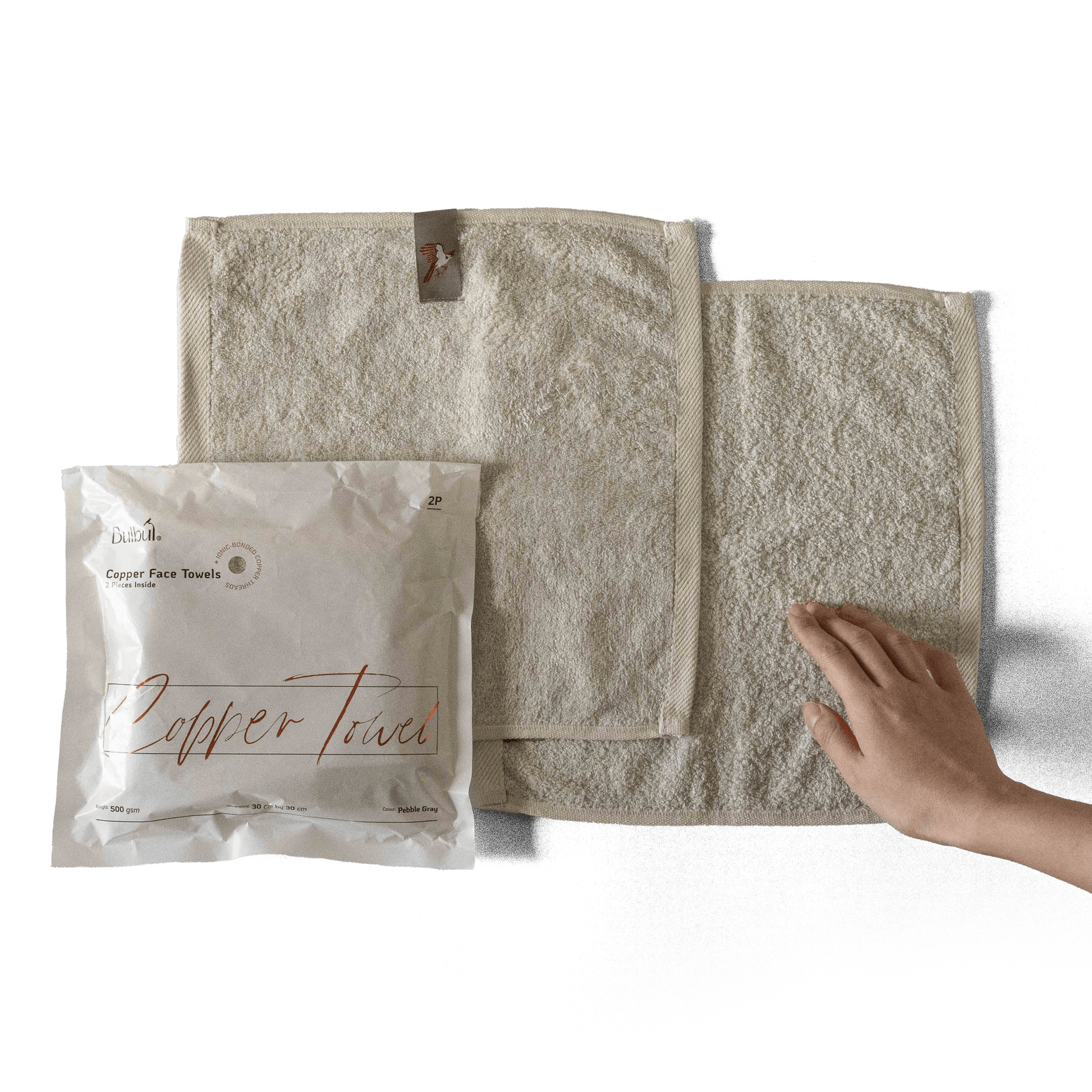 Bulbul Self-sanitizing Premium Copper Face Towel shown with packaging and hand for scale. Antibacterial and odour-resistant washcloth for home use.