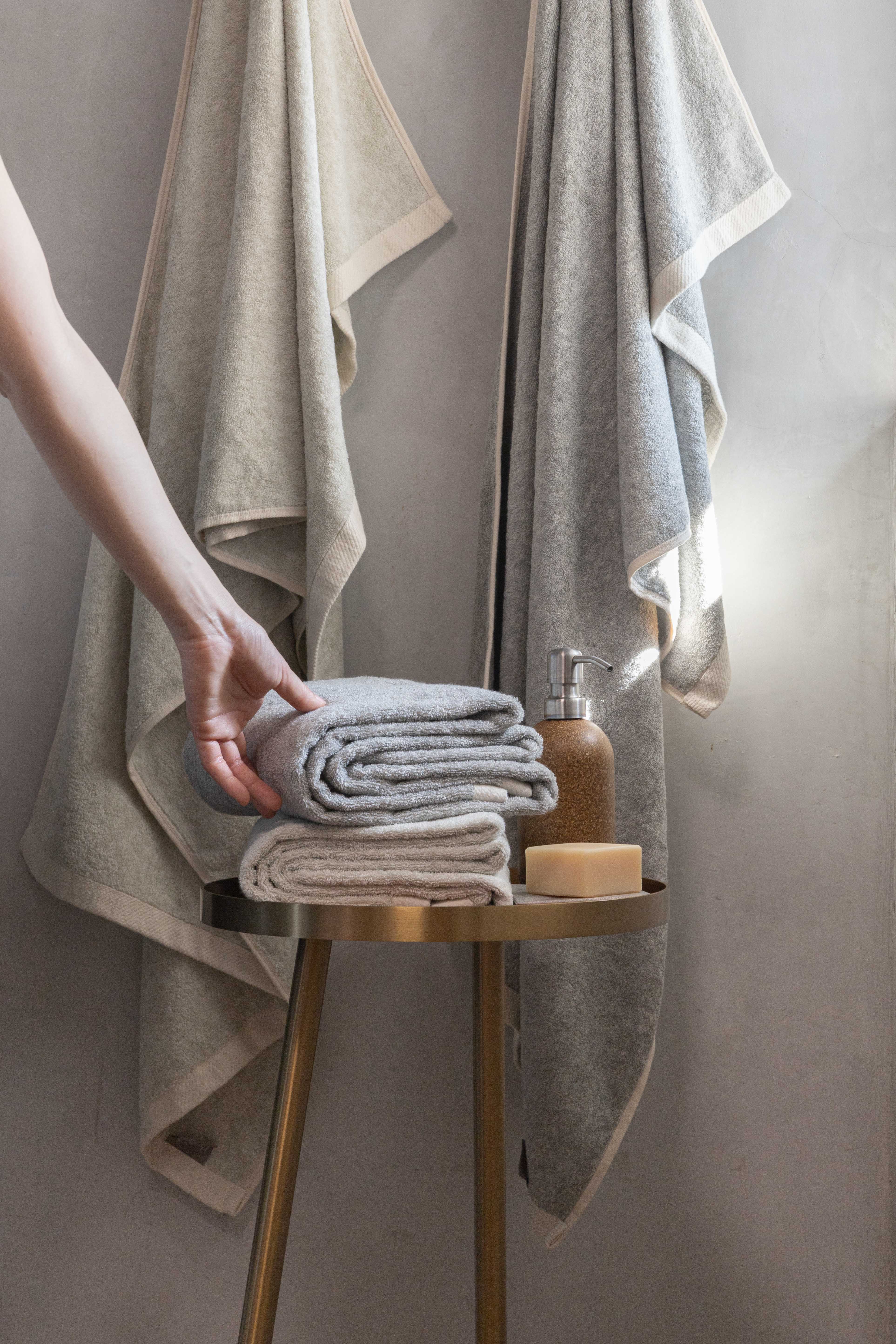 Copper towels folded on a stool with soap