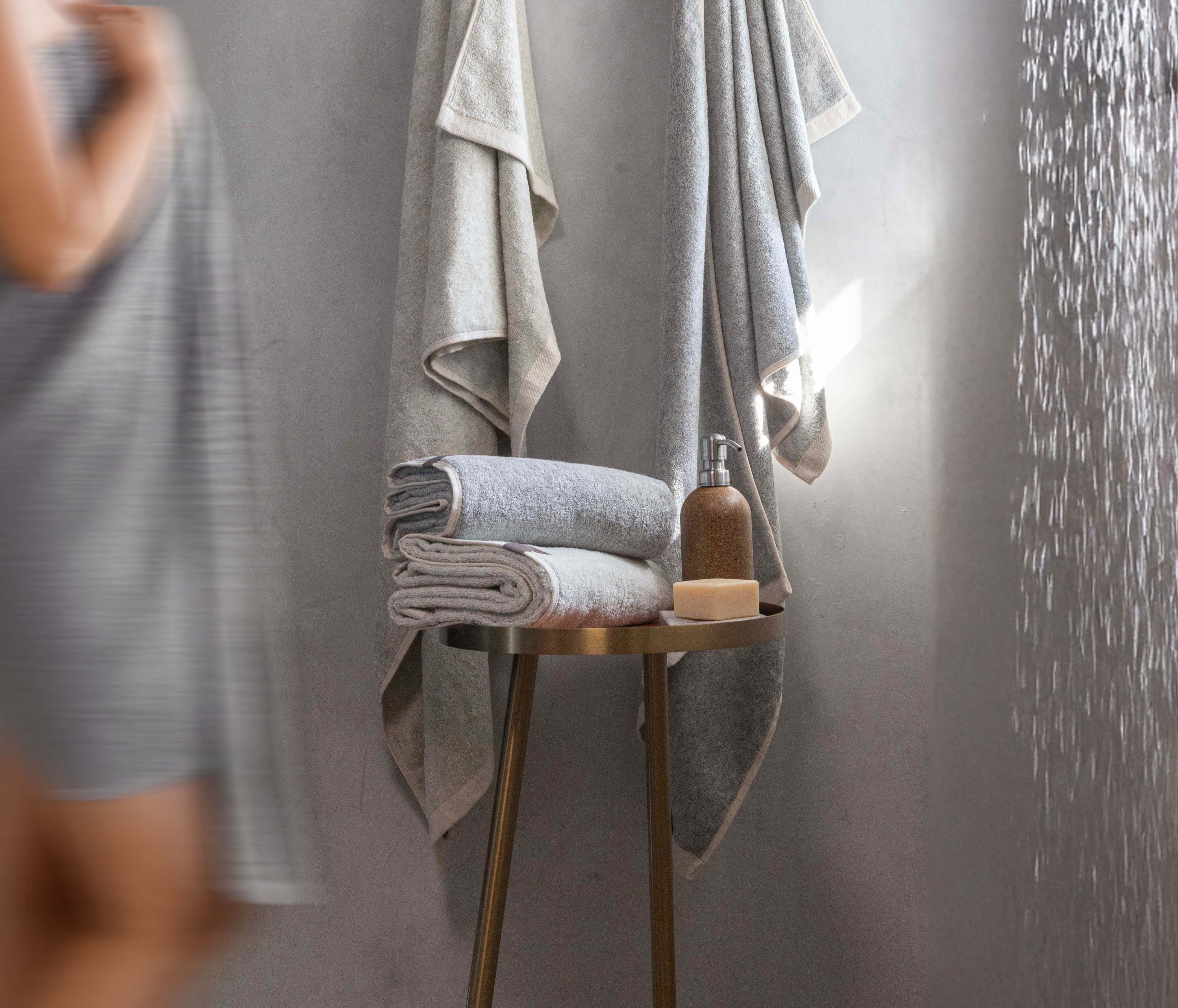 Copper towels hanging on a wooden rail