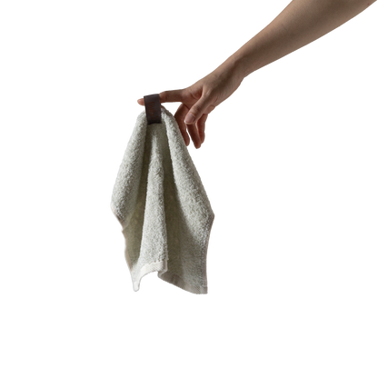 Bulbul Self-sanitizing Premium Copper Face Towel held by hand, showcasing antibacterial and odour-resistant washcloth for home and bath use.